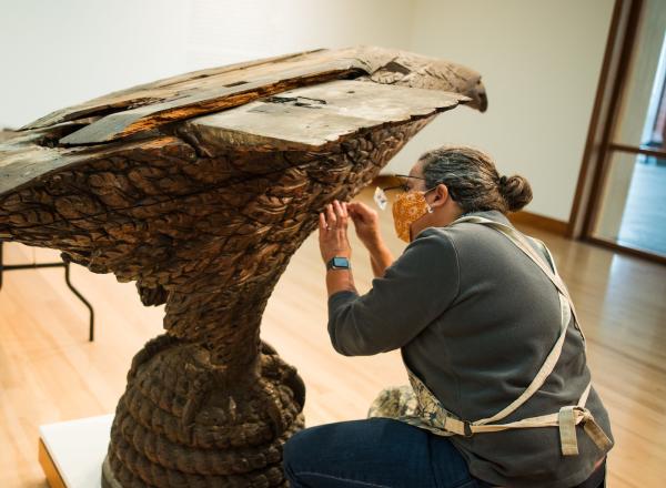 Pizzagalli Director of Conservation Nancie Ravenel at work conserving folk art sculpture by Laban Smith Beecher from the mid-19th century. Photography by Andy Duback