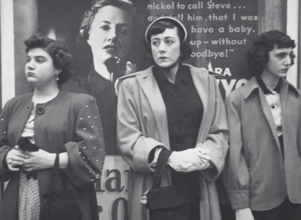 women waiting on the street