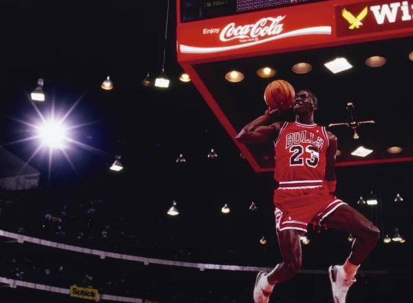 photo of Michael Jordan dunking ball, seen from below hoop