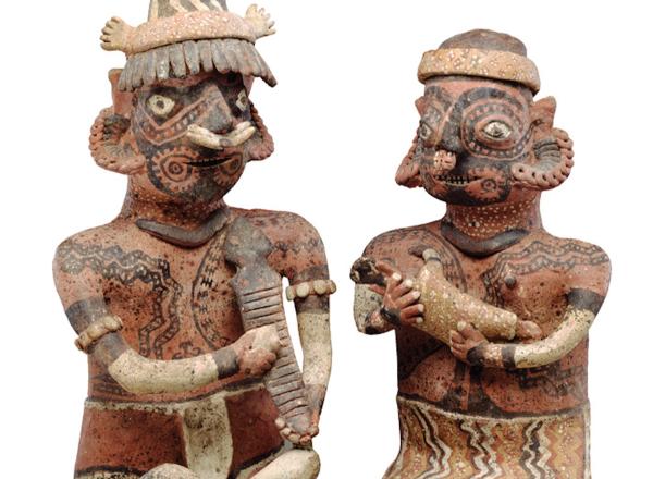 Two ceramic figurines from graves in western Mexico that show two heavily tattooed individuals. Photo: Detroit Institute of Arts.