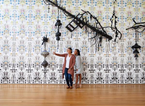 Visitors snap a selfie in front of new commissioned artwork and you did not even know enough to be sorry, 2022, by North Carolina artist Elizabeth Alexander