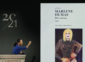 Auctioneer Yu-Ge Wang sells Miss January by Marlene Dumas for $13.6 million. Courtesy Christie's New York