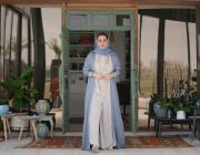 Omani artist Alia Al Farsi stands at door. Image by Burair Alkishri