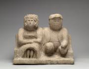 Edmonson, Bess and Joe, 1930-40. A a simple, stone sculpture of a couple sitting together, looking ahead. 