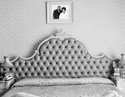 black and white photo of a bed 