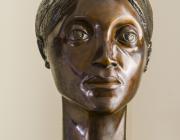 bronze bust of woman's head