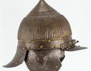 metal helmet with front and back bills, ear flaps and pointed top