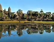 Angkor Wat temple makes up skyline beyond body of water 