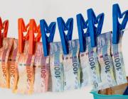 euros bills hanging to dry on a clothes line