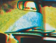 printed image of eyes in a rearview mirror