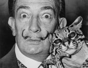 Salvador Dalí holding his pet ocelot, Babou