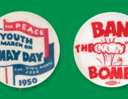 two anti-war buttons on a gree background