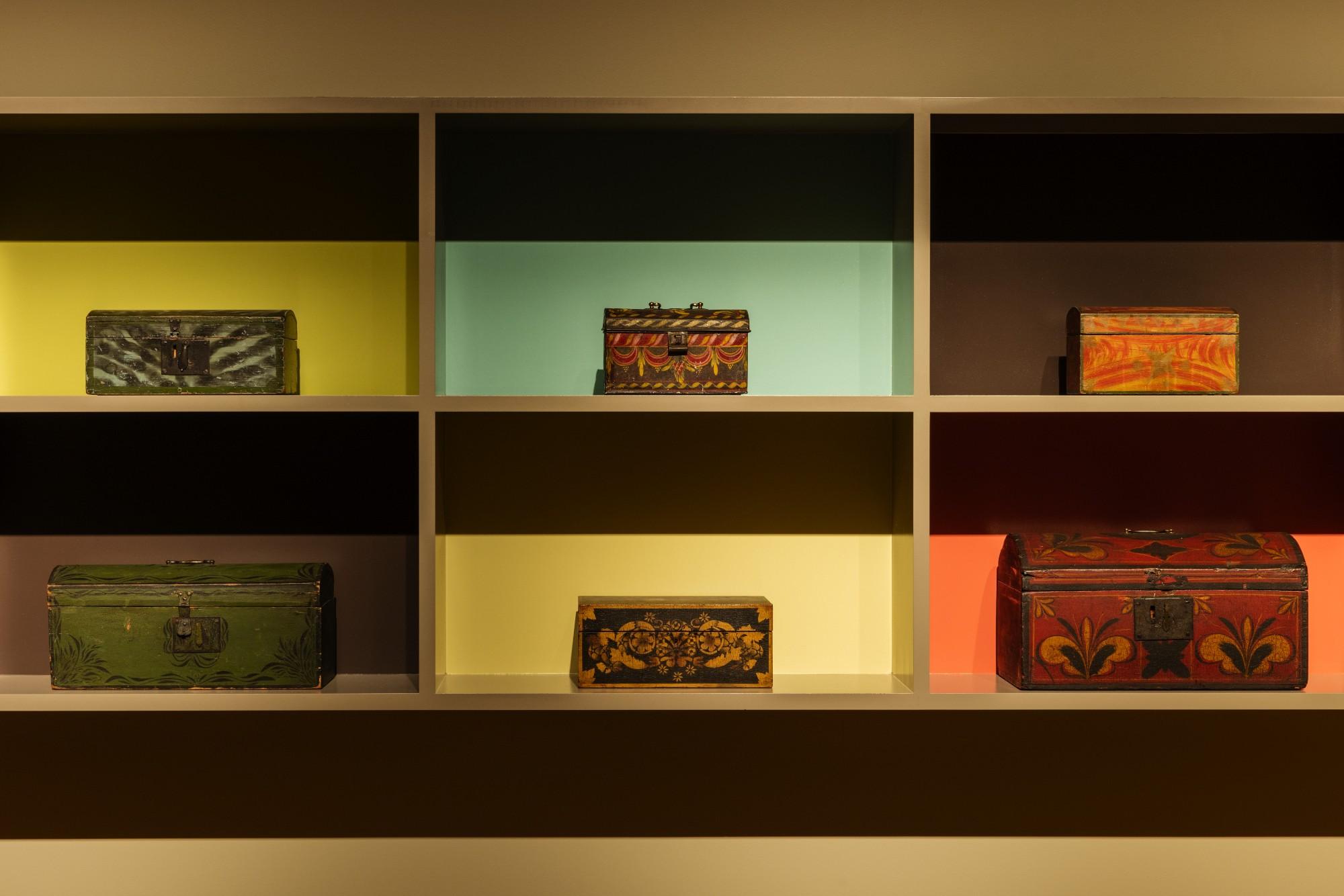 art gallery display of wooden boxes