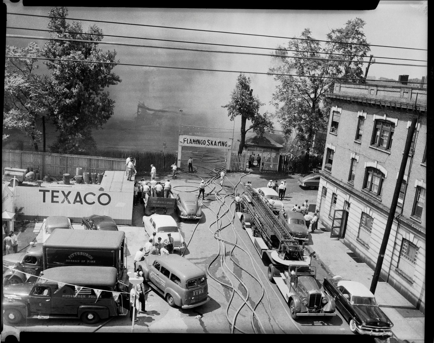 Charles “Teenie” Harris, ‘Fire fighters battling fire at Flamingo Skating rink, Larimer and Auburn Avenues, East Liberty,’ July 1954