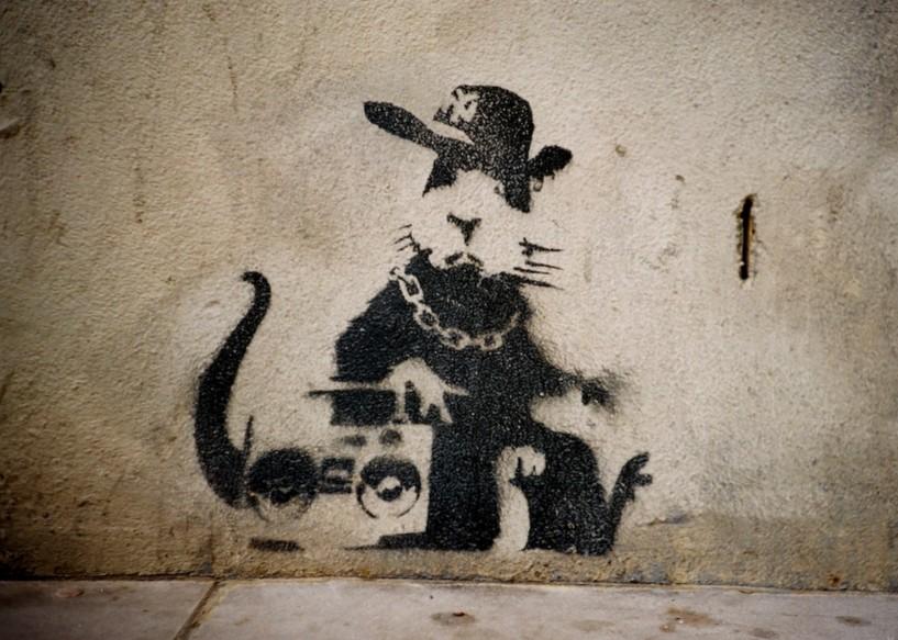 banksy rat graffiti, small rat dressed in hat and chain with boombox