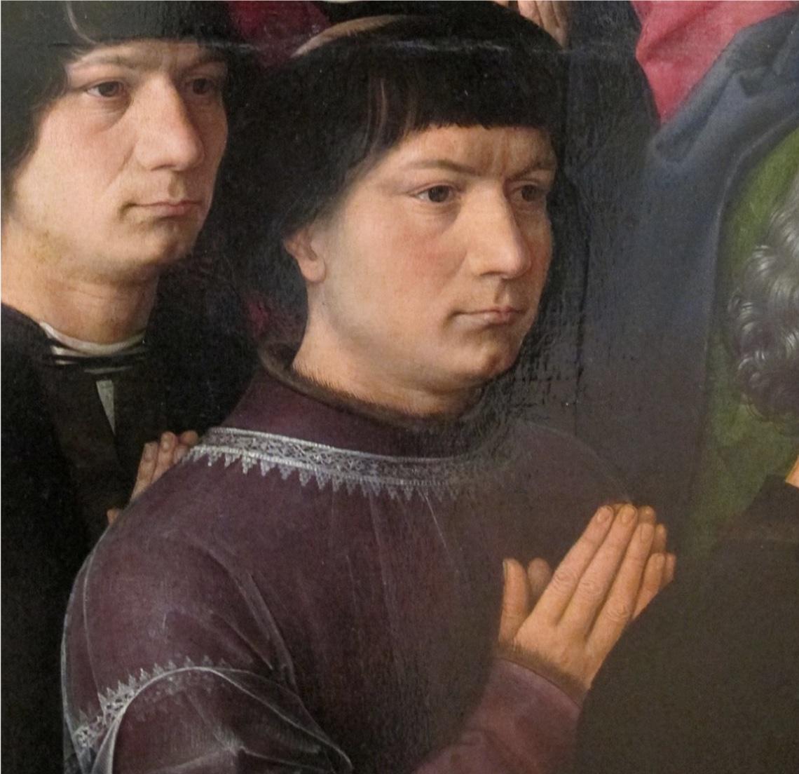 Detail of a man whose clothes have lace trimming in Memling's The Virgin and Child between St James and St Dominic.