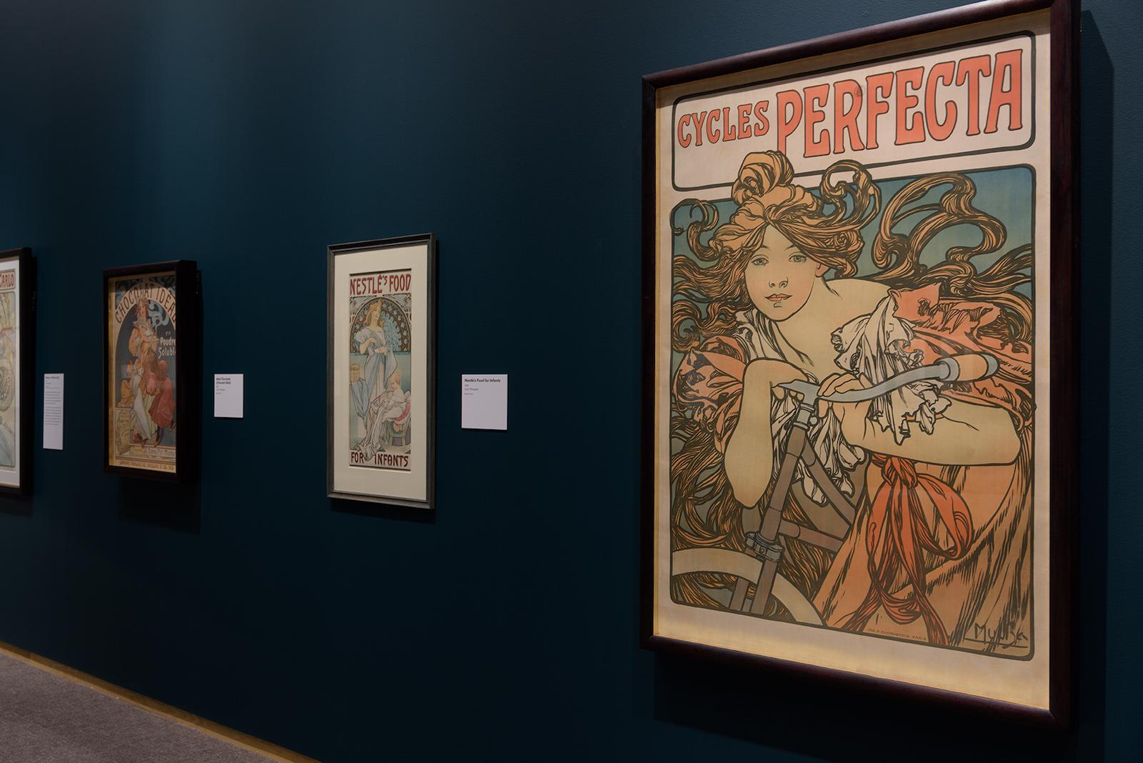 Installation view of Alphonse Mucha: Art Nouveau Visionary featuring Cycles Perfecta.
