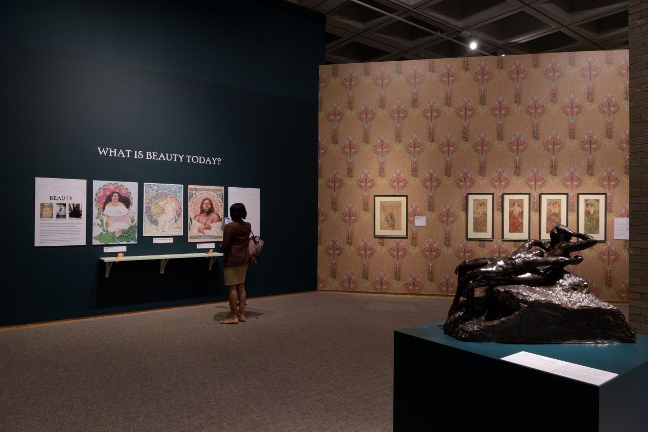 Installation view of Alphonse Mucha: Art Nouveau Visionary featuring artwork created for the Modern Beauty Campaign.