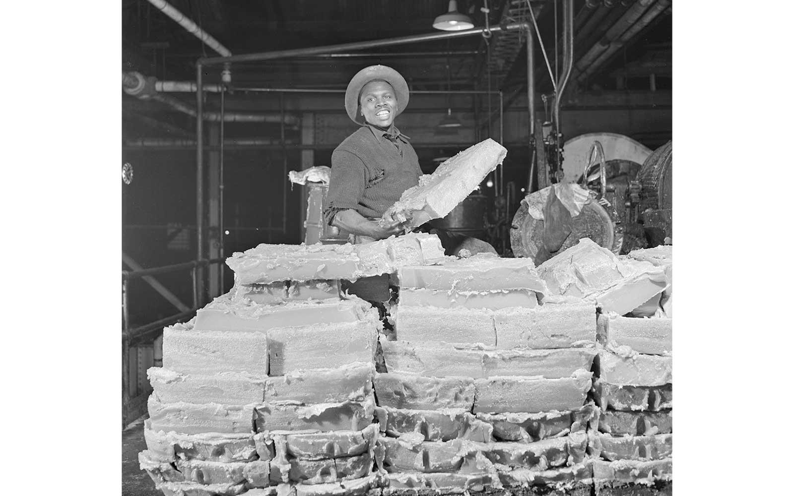 Gordon Parks, Large squares of grease that have been cooled in pans. Although not extremely hard, the cakes are solid enough to pick up in one piece, March 1944.