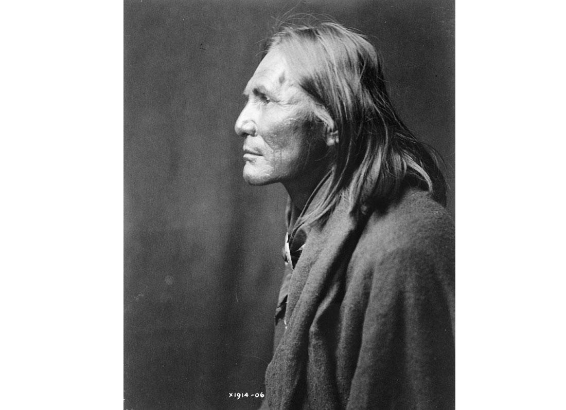 Alchise, Apache Indian, half-length portrait, left profile, 1906.