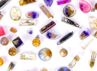 Various resin charms of different shapes and colors on a white background.