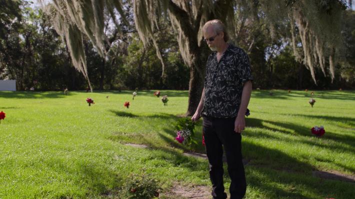  Bob Ross- Happy Accidents, Betrayal & Greed - Production Still of Steve Ross visiting his father's grave.  