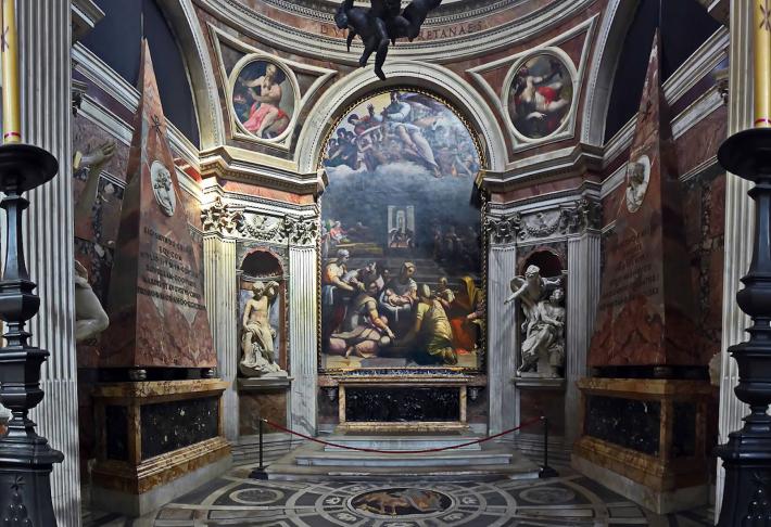 a look into the Chigi Chapel, small yet ornate with white marble, dark green, pink and gold details. 