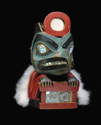 Lkaayaak yeil s'aaxw (Box of Daylight Raven Hat), ca. 1850, Native American, Tlingit, Taku, maple, mirror, abalone shell, bird skin, paint, sea lion whiskers, copper, leather, Flicker feathers, 11 7/8 x 7 3/4 x 12 1/4 in. (30.2 x 19.7 x 31.1 cm), Gift of John H. Hauberg, 91.1.124. 