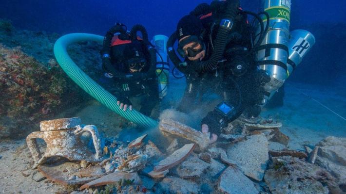  Divers work to recover and study remains from the Antikythera shipwreck in 2012. Credit: Brendan Foley, Woods Hole Oceanographic Institution.