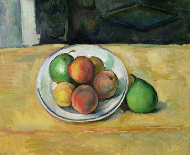 Cezanne still life of fruit in a white bowl on a tan table
