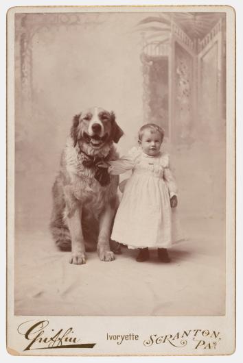 vintage photograph of a toddler and golden retriever
