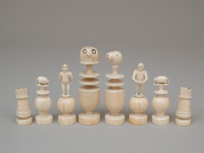 chess set in white ivory featuring animals