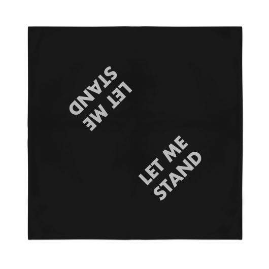 Jenny Holzer black bandana with text "let me stand" in white on it twice