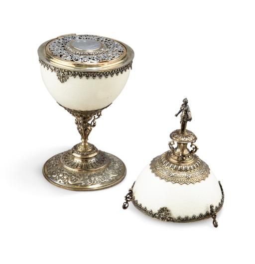 J.D. Schleissner Sohne, Hanau, A silver-gilt-mounted ostrich egg cup, circa 1890. Height 13 inches (33 cm). Estimate 2,000 - 3,000 EUR..