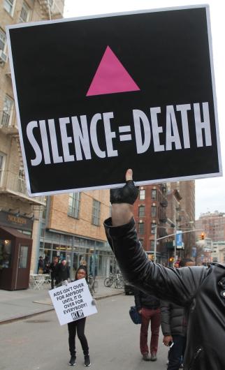Detail of image that reads silence equals death featuring a pink triangle
