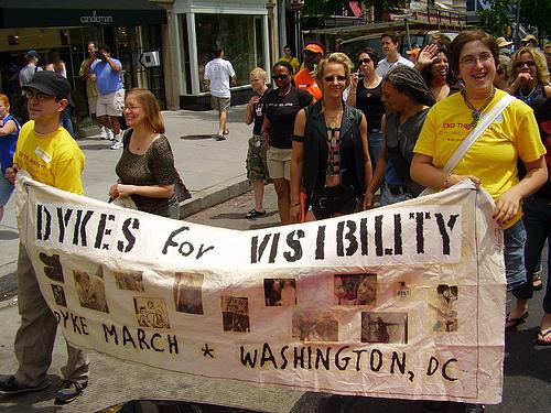 Image of protesters carrying banner that says dykes for visability