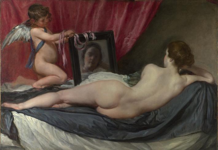 Rokeby Venus painting- a nude white woman laying on her side, shown from behind, looking at herself in a mirror held up by cupid