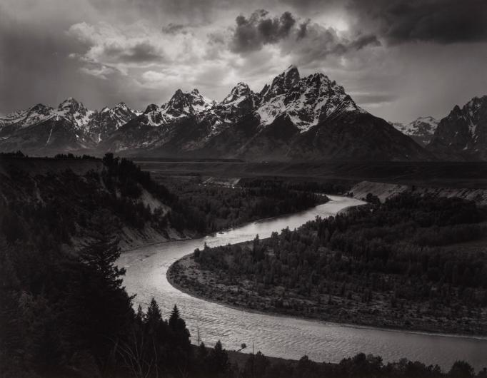 Ansel Adams black and white photograph of a river and mountains